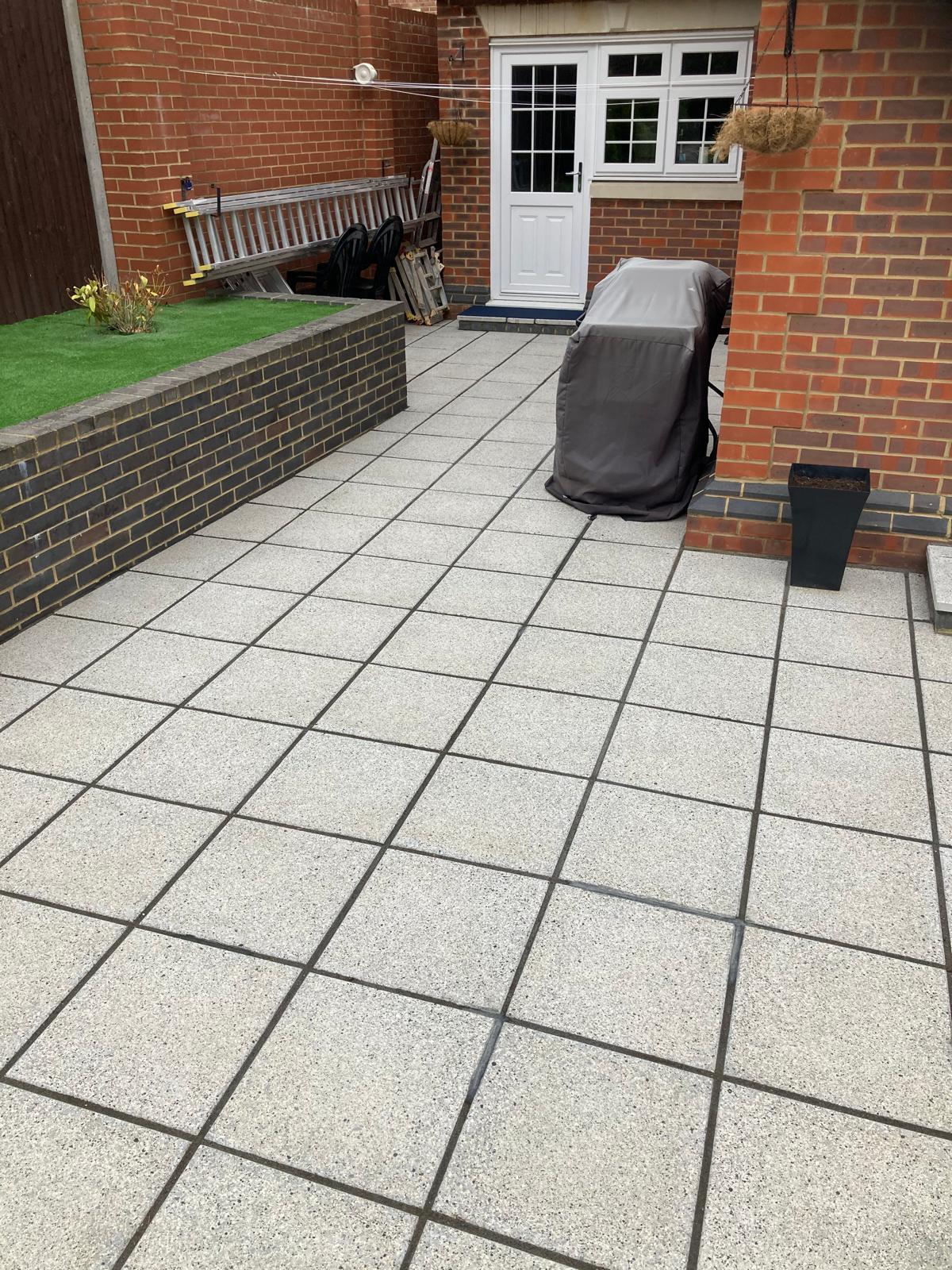 Wrap around porcelain patio and driveway works